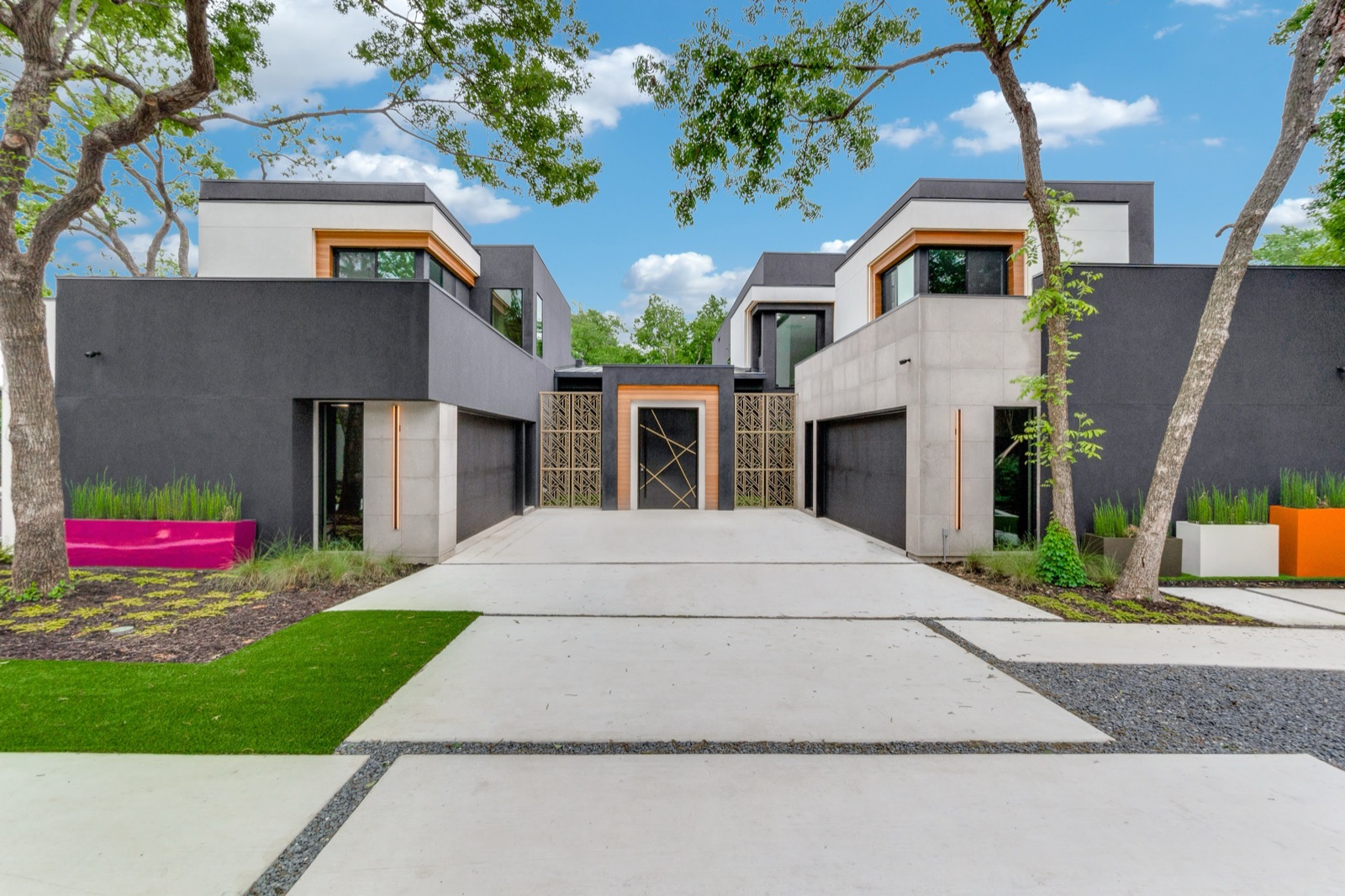 Bold contemporary Dallas home with steel-framed glazing and a custom metal entry screen.